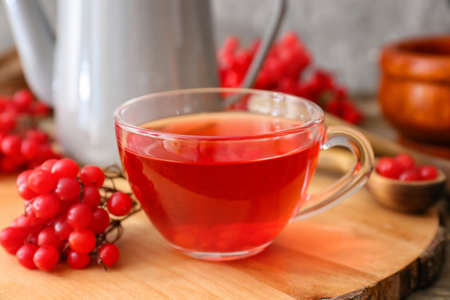 Cup of healthy viburnum tea on table, closeupの写真素材