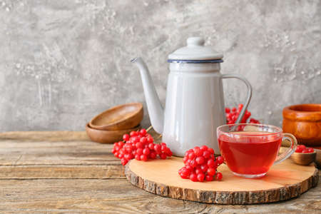 Cup of healthy viburnum tea on tableの写真素材