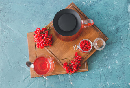 Healthy viburnum tea on color backgroundの写真素材