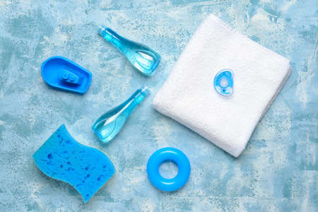 Set of bath accessories for baby on color background