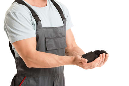 Miner man with coal on white backgroundの写真素材