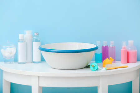 Bath accessories for baby on table in background