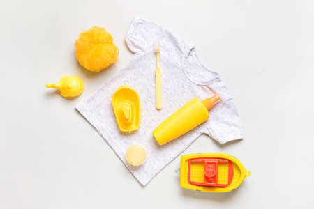 Bath accessories for baby and clothing on light backgroundの写真素材