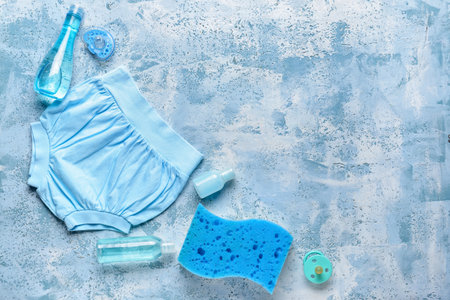 Set of bath accessories for baby on color backgroundの写真素材