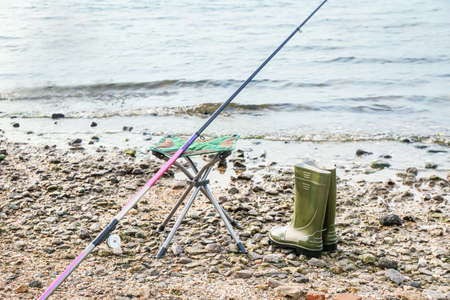 Equipment of fisherman on river bankの写真素材