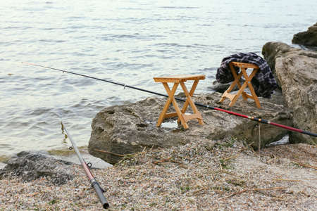 Equipment of fisherman on river bankの写真素材