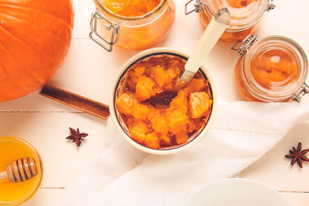 Bowl of tasty pumpkin jam on tableの写真素材