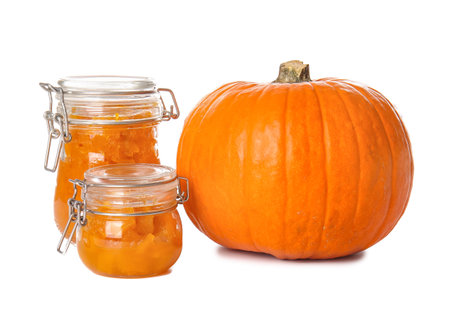 Jars of tasty pumpkin jam on white backgroundの写真素材