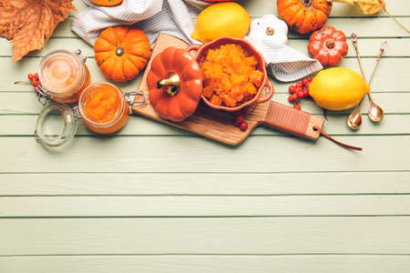 Autumn composition with tasty pumpkin jam on wooden backgroundの写真素材