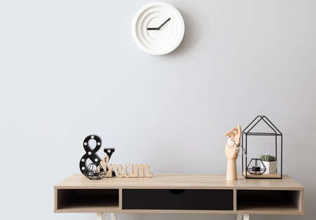 Wooden hand with stylish decor on table in interior of room