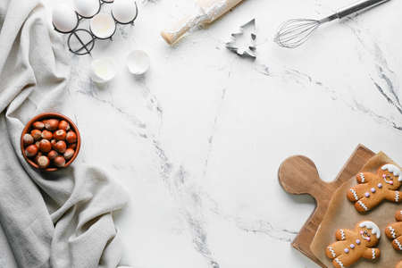Composition with gingerbread cookies and ingredients on white background