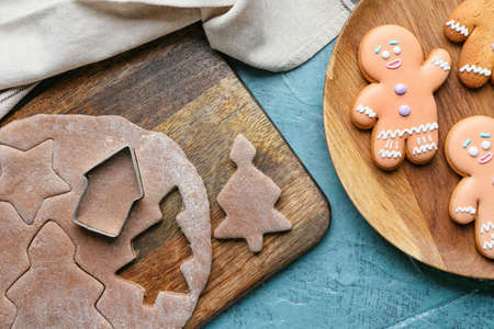 Fresh dough for gingerbread cookies and cutter on tableの写真素材