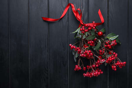 Mistletoe branch on dark wooden backgroundの写真素材