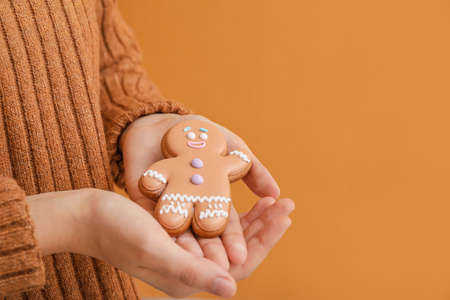 Woman holding Christmas cookie, closeupの写真素材