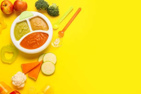 Composition with healthy baby food on color backgroundの写真素材