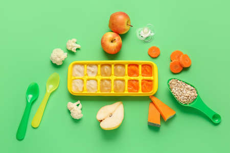Composition with healthy baby food on color backgroundの写真素材