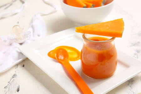 Composition with healthy baby food and ingredients on light background, closeupの写真素材