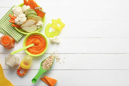 Composition with healthy baby food on light wooden backgroundの写真素材