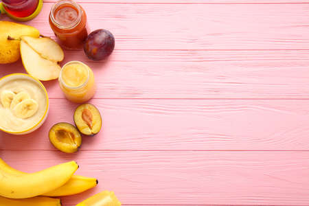 Composition with healthy baby food and ingredients on color wooden backgroundの写真素材