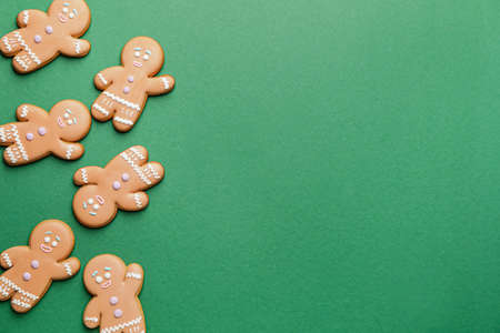 Tasty gingerbread cookies on color backgroundの写真素材