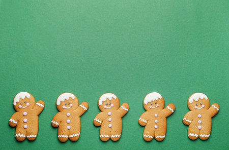 Tasty gingerbread cookies on color backgroundの写真素材