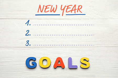 Empty to-do list for new year on white wooden background
