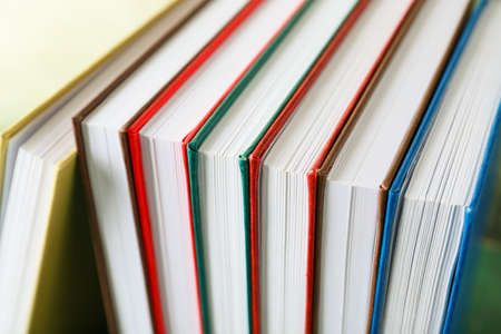 Stack of books on color background, closeupの写真素材
