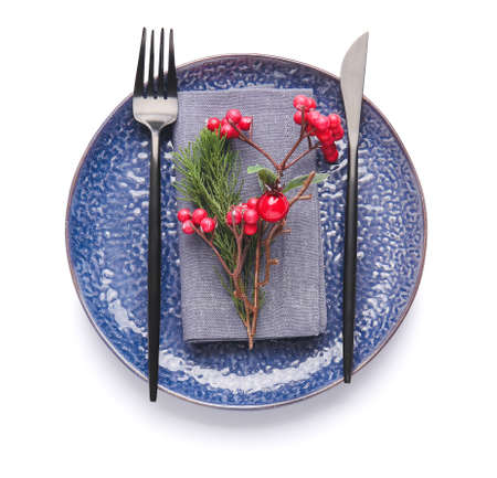 Beautiful Christmas table setting with mistletoe on white background