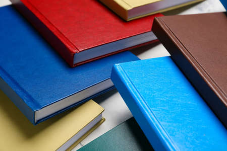 Stack of books on light background, closeup