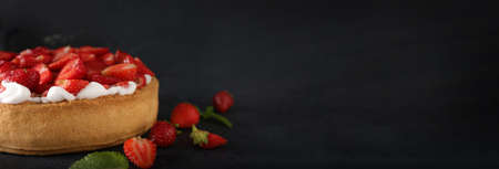 Tasty strawberry pie on black background with space for textの写真素材
