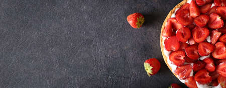 Tasty strawberry pie on dark background with space for textの写真素材