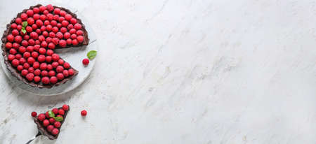 Tasty cut raspberry pie on light background with space for text