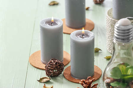 Beautiful aroma candles on wooden backgroundの写真素材
