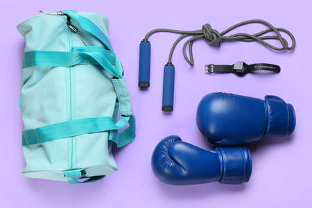 Composition with bag and sports equipment on color backgroundの写真素材