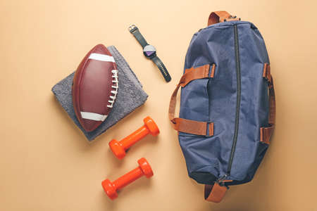 Composition with bag and sports equipment on color backgroundの写真素材