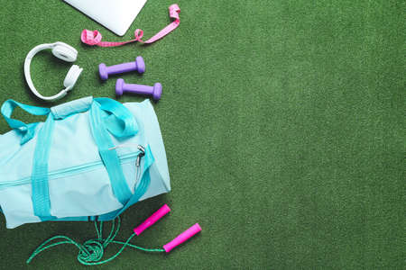 Composition with bag and sports equipment on color backgroundの写真素材