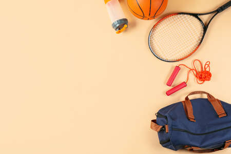 Composition with bag and sports equipment on color backgroundの写真素材