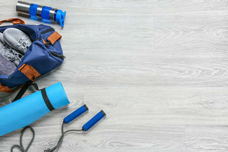 Set of sports items on gray wooden backgroundの写真素材