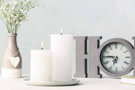 Beautiful aroma candles on table in room
