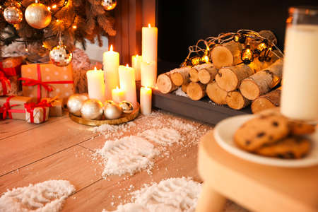 Footprints of Santa on floor in room decorated for Christmasの写真素材