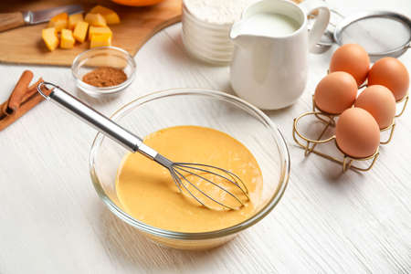 Preparing of tasty pumpkin muffins on tableの写真素材