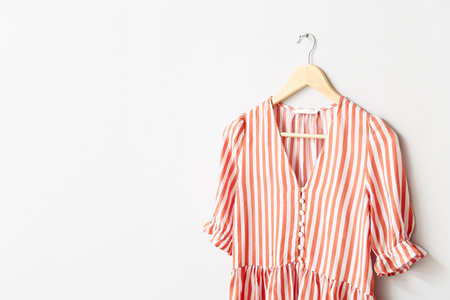 Hanger with blouse on white backgroundの写真素材