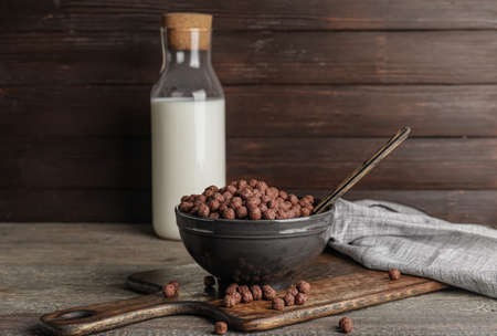 Composition with tasty chocolate corn balls on wooden backgroundの写真素材