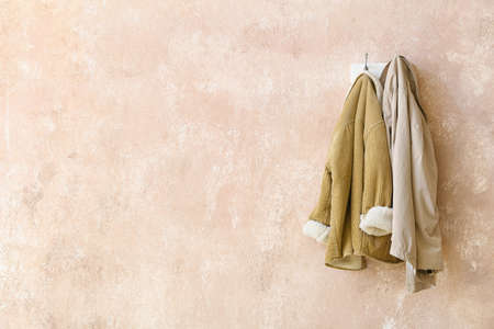 Hanger with clothes on color backgroundの写真素材