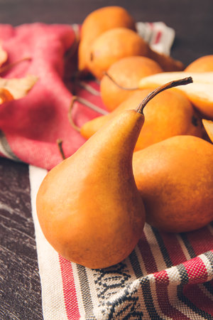 Fresh ripe pears on dark background