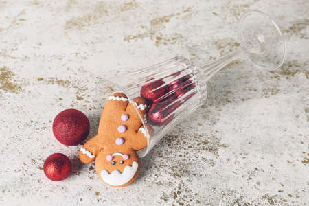 Gingerbread cookie with Christmas decor and glass on white background