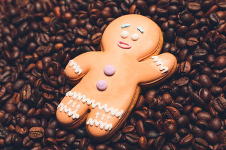 Gingerbread cookie on roasted coffee beans