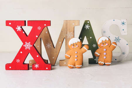 Christmas composition with gingerbread cookies on white backgroundの写真素材