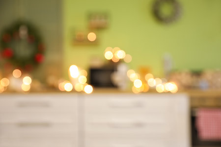Interior of modern kitchen decorated for Christmas, blurred viewの写真素材
