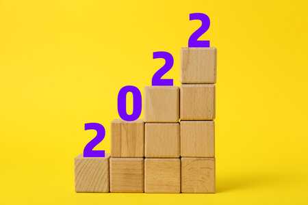 Wooden cubes with figure 2022 on color backgroundの写真素材